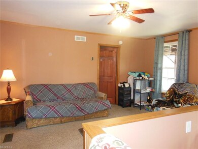 Living room -- at right is stairway to the basemen