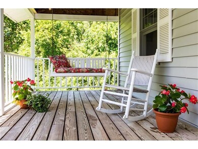 Shaded front porch comes with ocean...