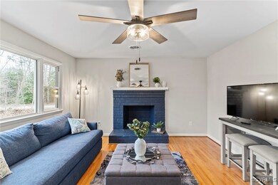 Living room featuring wood finished floors, a ceil
