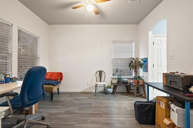 Office with ceiling fan, wood finished floors, an