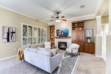 Living area with built in features, crown molding