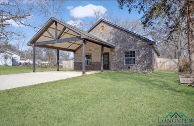View of front of house with brick siding, a front 