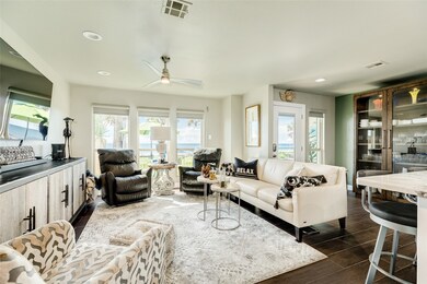 Looking back across the living room toward the fro