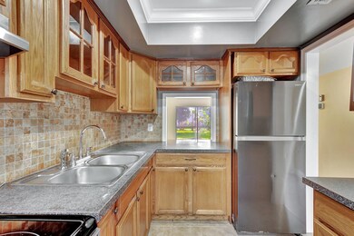 Spacious kitchen with door to outside