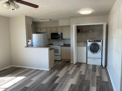 Kitchen with washer and dryer, white appliances, 