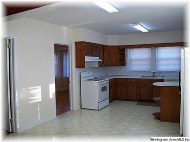 Kitchen with eating space and all appliances remai