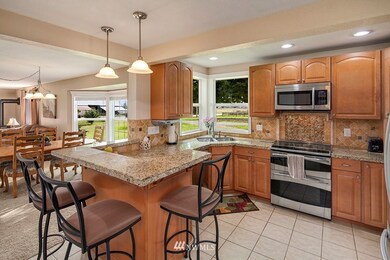 Open kitchen with under cab lighting and views of pastures