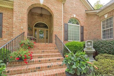 Elegant curved entry and covered porch