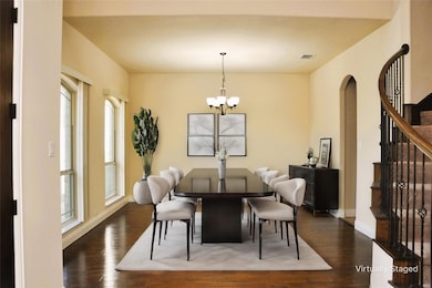 Dining space featuring dark wood-type flooring and