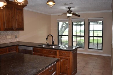 Island in kitchen and open to breakfast area