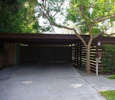 LARGE CARPORT WITH LOCKED  BUILT IN STORAGE ON BAC