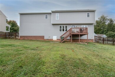 The rear of the home features a deck. It is perfec