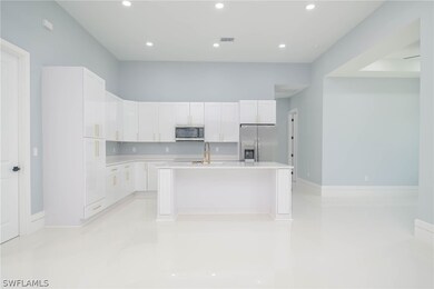Kitchen with sink, appliances with stainless steel