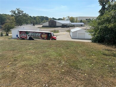 View of yard featuring an outdoor structure and a garage