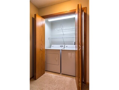 Extra lighting brightens the laundry area.. Washer