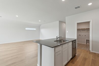Kitchen in the Hayden home plan by Trophy Signature Homes – REPRESENTATIVE PHOTO