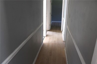 Hall featuring light wood finished floors