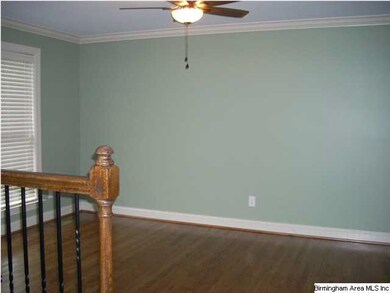 The living room is large freshly painted in a soft