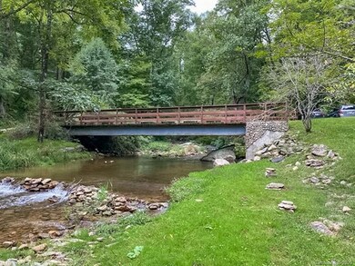 Nestled in the woods on 9+ acres, this large main 