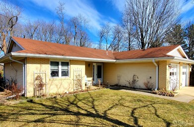 Well Maintained Exterior with Lovely Flowers in the Spring