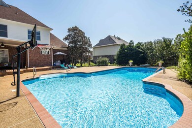 View of pool featuring a patio area and a diving b