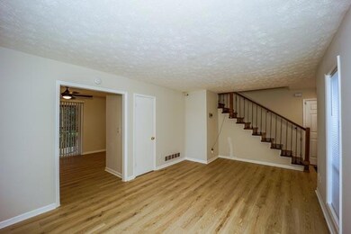 Unfurnished room with a textured ceiling and light
