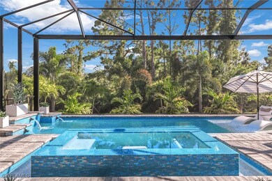 View of swimming pool with glass enclosure, an in