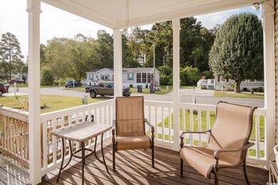 Deck with a yard and covered porch