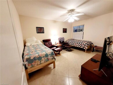 Bedroom featuring a textured ceiling and a ceiling
