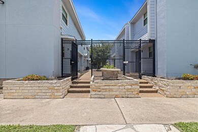 Gated entry with a clean, modern courtyard—private