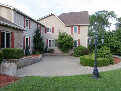 The front of the home stuns with its huge patio an