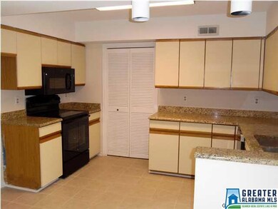 Kitchen features a new tiled floor, new appliances