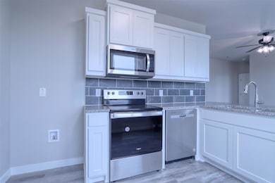 Kitchen featuring light hardwood / wood-style floo