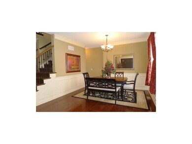 FORMAL DINING AREA WITH HARD WOOD FLOORS.