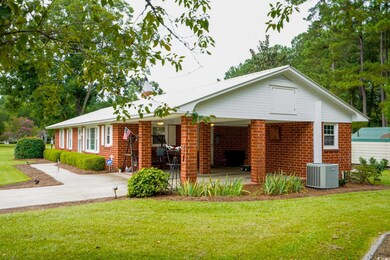 Ranch-style home with central air condition unit a