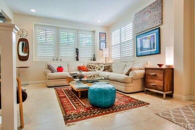 The living room features beautiful porcelain tile 