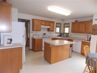 Spacious kitchen with pantry, island, disposal and