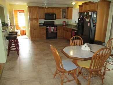 KITCHEN AND DINING AREA LOOKING AT MUD ROOM