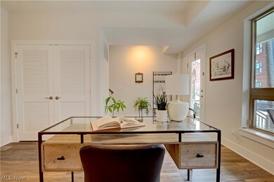 Home office featuring dark hardwood / wood-style flooring