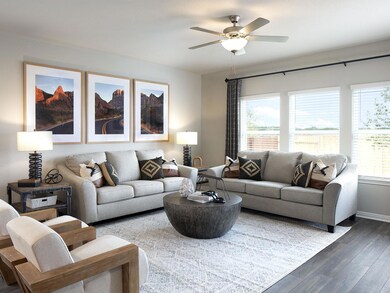 Living room featuring wood finished floors, a cei