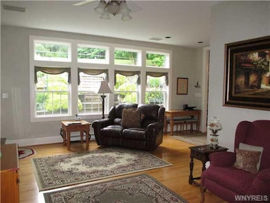 Great Room. Wall of Windows overlooks a hillside g