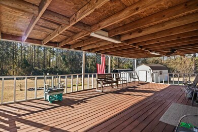 Deck with ceiling fan and a storage unit