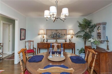 Dining Room open to Hallway and Sunroom. Kitchen t