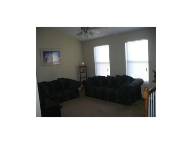 Spacious Living Room with Vaulted Ceiling and Open