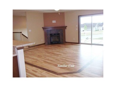 Living Room. Picture is of Similar Unit.