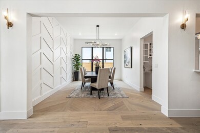 The elegant dining room features a custom wood pan