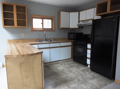 The kitchen is open to the dining area and comes complete with Dishwasher, Range and Refrigerator
