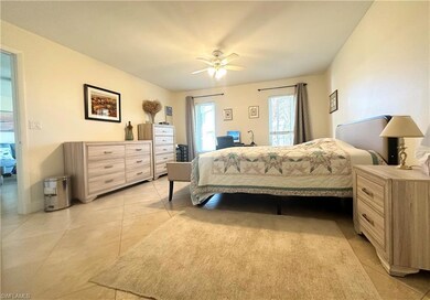 Bedroom featuring light tile patterned flooring an
