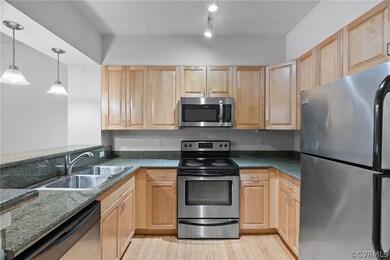 Kitchen with light hardwood / wood-style floors, t