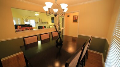 Great open Dining Room with hardwood, crown moldin